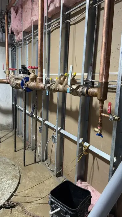 A backflow prevention assembly on a copper main.