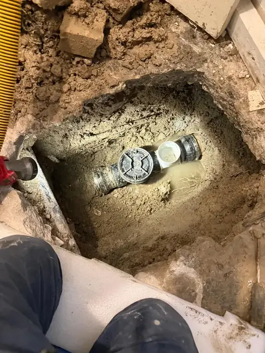 A backwater valve installed on a main line before backfill.