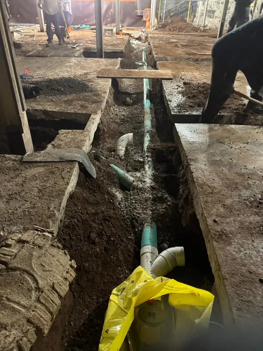 A water service and drainage run laid before the slab goes back.