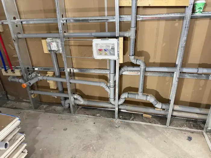 Supply and drain rough in for a laundry room.